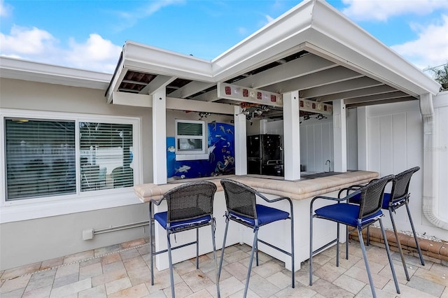 view of patio / terrace with exterior bar