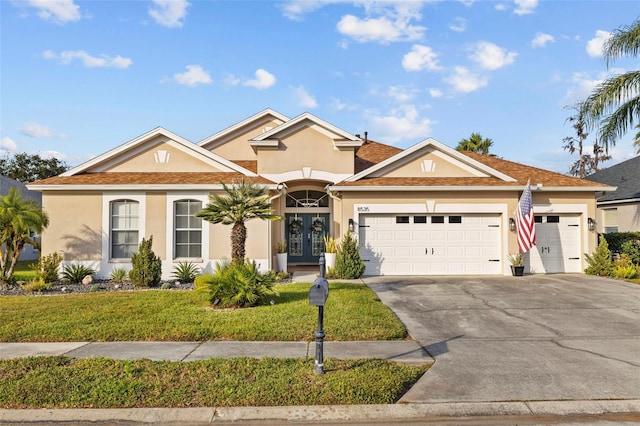 view of front of property with french doors and a front yard