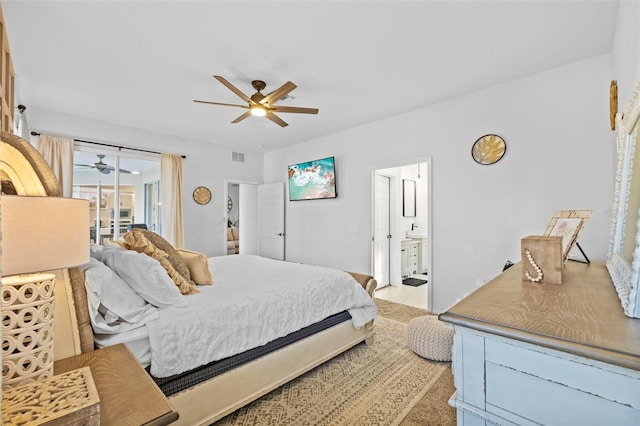 bedroom with ceiling fan, access to exterior, light carpet, and ensuite bath