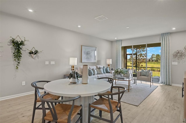 dining space featuring light hardwood / wood-style flooring