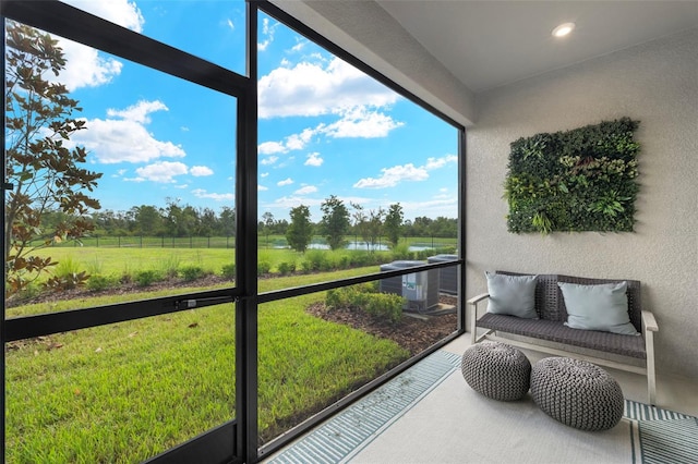 sunroom / solarium featuring a rural view