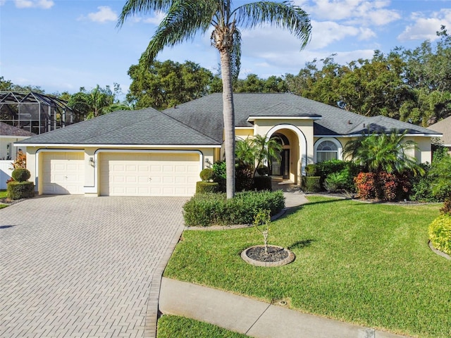 view of front facade with a garage and a front yard