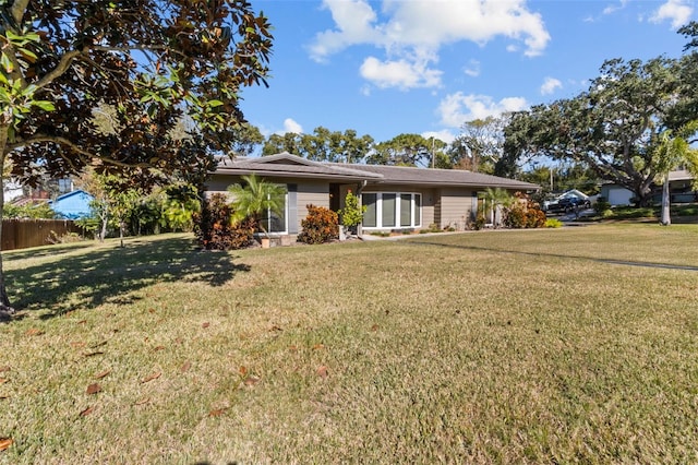 ranch-style house with a front yard