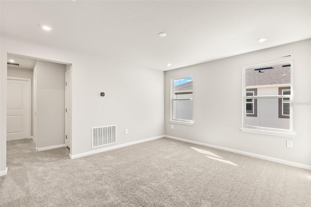 empty room with light colored carpet