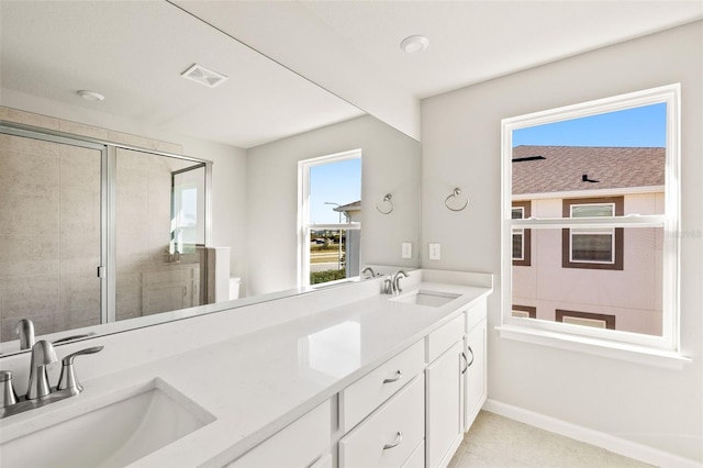 bathroom featuring vanity, toilet, and walk in shower