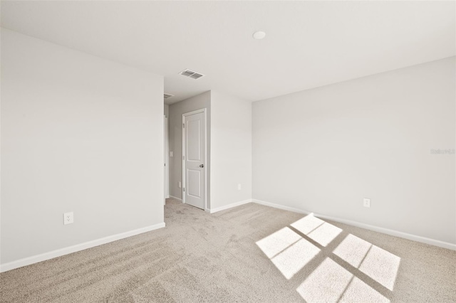 empty room with light colored carpet