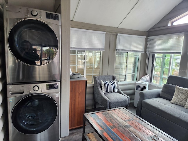 washroom featuring wood-type flooring and stacked washer and dryer