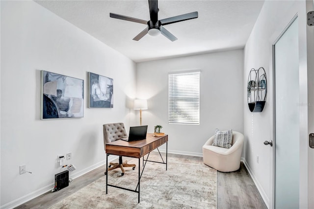 office area with ceiling fan and light wood-type flooring