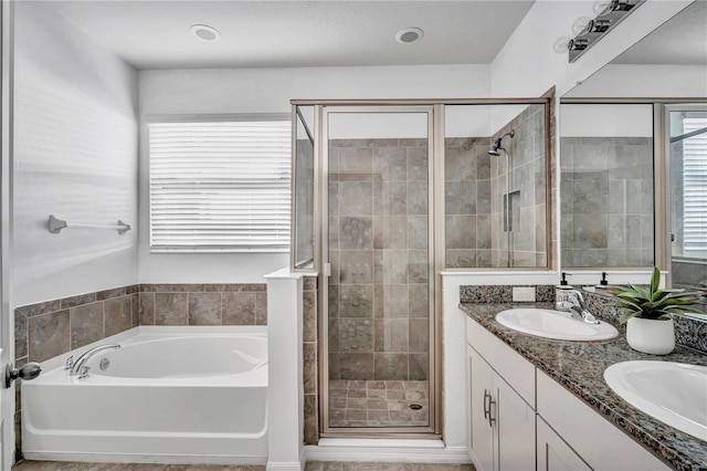 bathroom featuring vanity and plus walk in shower