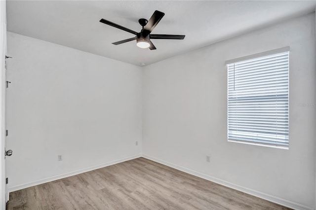 spare room with ceiling fan and light hardwood / wood-style flooring