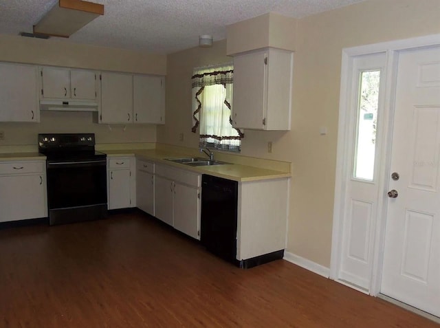 kitchen with white cabinets, a textured ceiling, dark hardwood / wood-style flooring, and black appliances