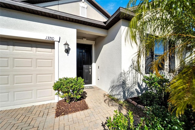 entrance to property featuring a garage