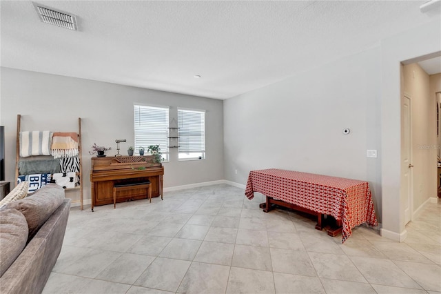 bedroom featuring light tile patterned floors