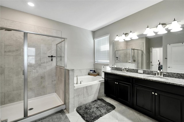 bathroom featuring tile patterned floors, vanity, and plus walk in shower