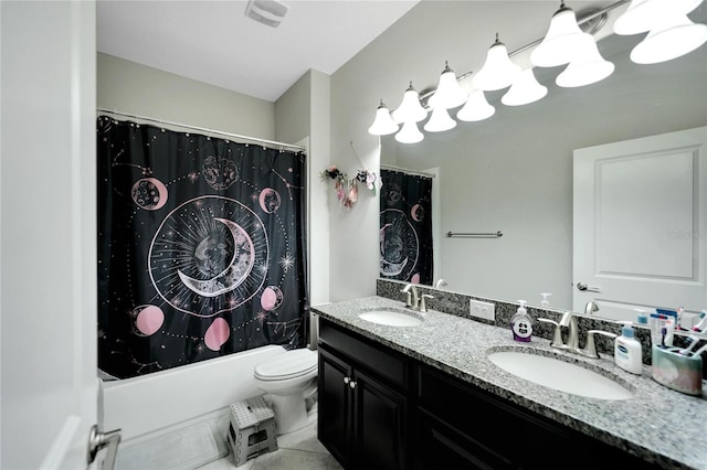 full bathroom with tile patterned floors, shower / bath combo, toilet, and vanity