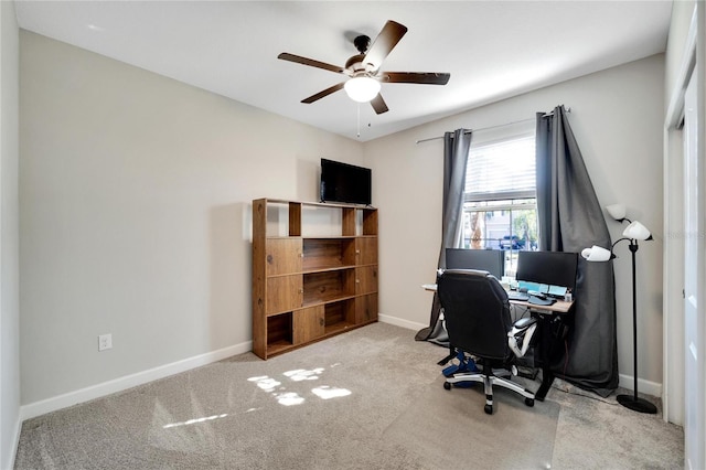 carpeted office with ceiling fan