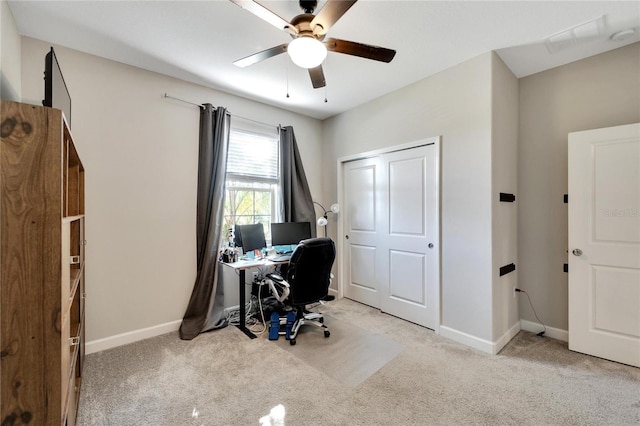 home office with ceiling fan and light colored carpet