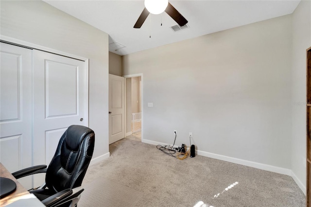 office space featuring ceiling fan and light colored carpet