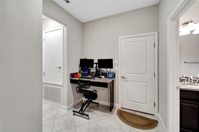 tiled home office with sink