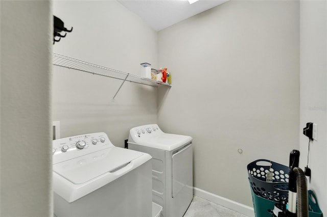 laundry area featuring washing machine and clothes dryer