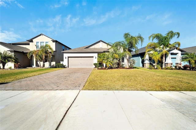 view of front facade featuring a garage and a front lawn