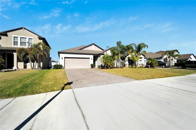 view of front of house featuring a front lawn and a garage