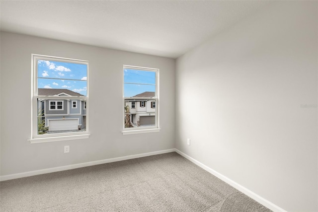 unfurnished room with carpet flooring