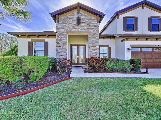 view of front of home featuring a front lawn, a garage, and french doors