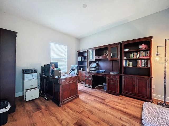 office space with light hardwood / wood-style floors