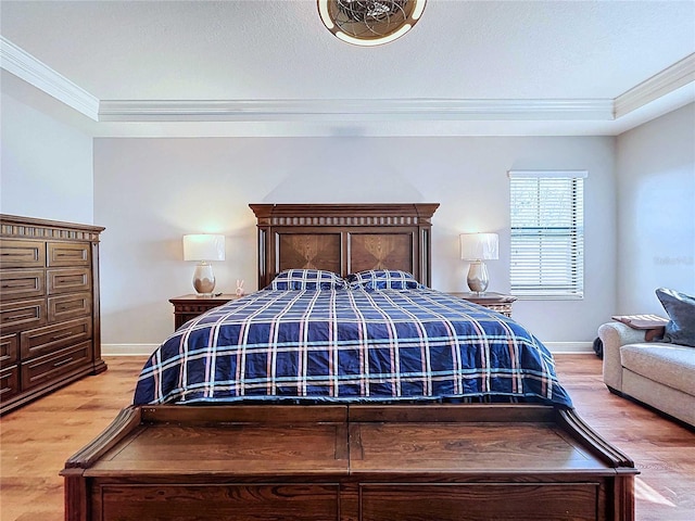 bedroom with wood-type flooring and crown molding