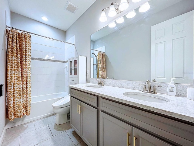 full bathroom with shower / bath combo, vanity, toilet, and tile patterned floors