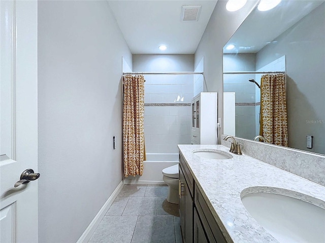 full bathroom with tile patterned floors, shower / bath combo, toilet, and vanity