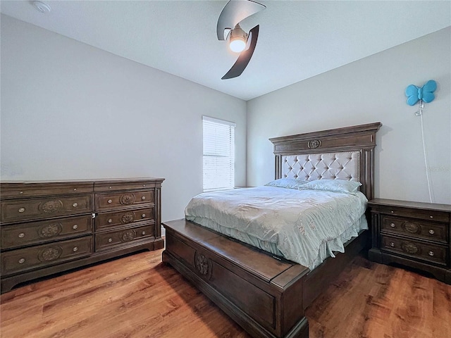 bedroom featuring hardwood / wood-style flooring and ceiling fan