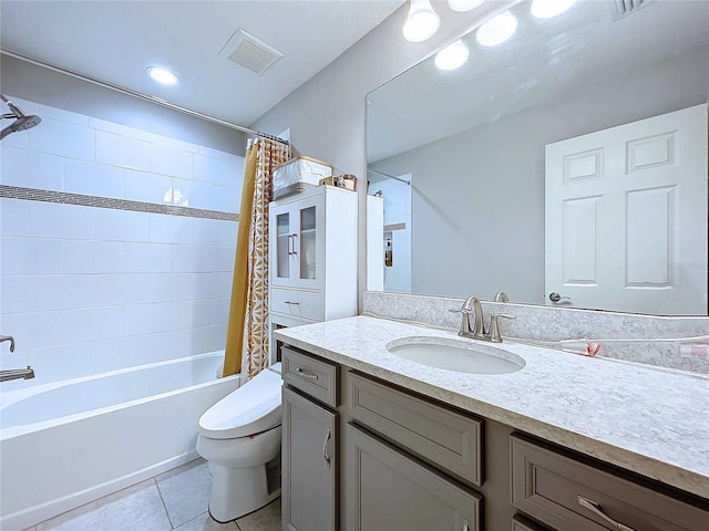 full bathroom featuring tile patterned floors, vanity, shower / bath combination with curtain, and toilet