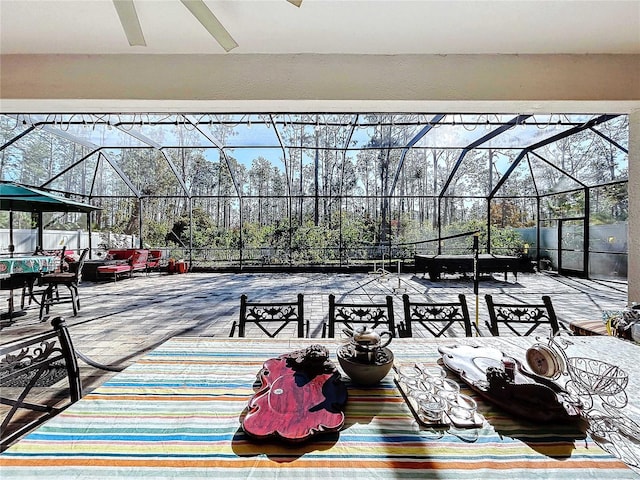 view of patio with a lanai and ceiling fan