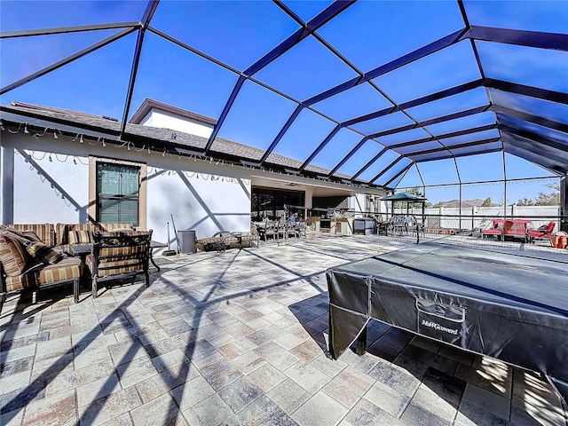 view of patio featuring a lanai and an outdoor living space