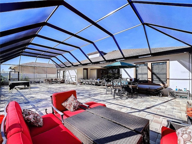 view of patio with outdoor lounge area and a lanai