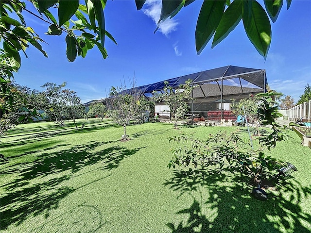 view of yard with glass enclosure