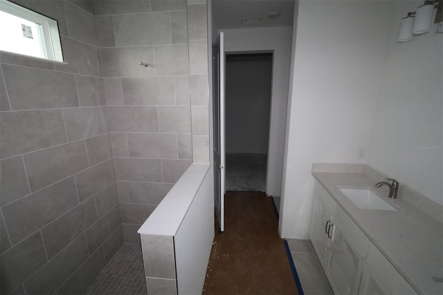 bathroom with vanity and walk in shower