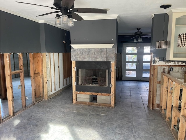 unfurnished living room with french doors, ceiling fan, and crown molding