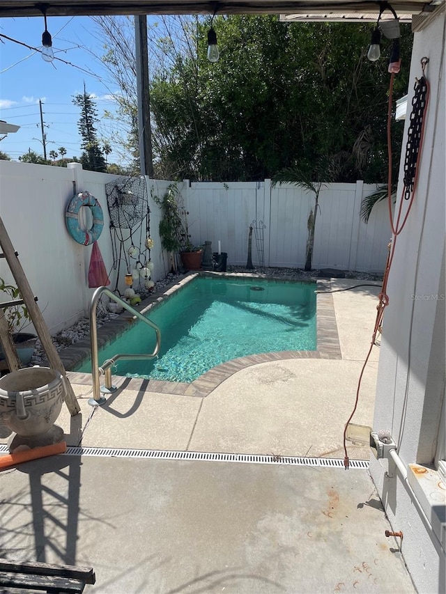 909 Mandalay Ave, Clearwater Beach, FL 33767 - view of swimming pool with a fenced backyard, a fenced in pool, and a patio area