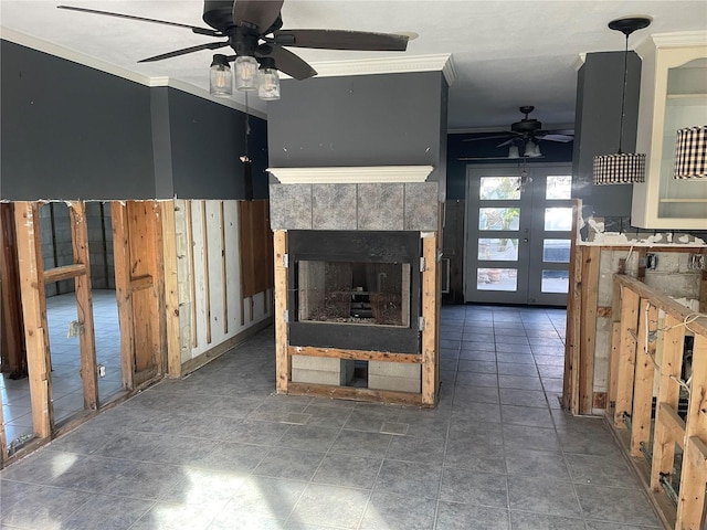 909 Mandalay Ave, Clearwater Beach, FL 33767 - unfurnished living room featuring a tiled fireplace, a ceiling fan, and crown molding