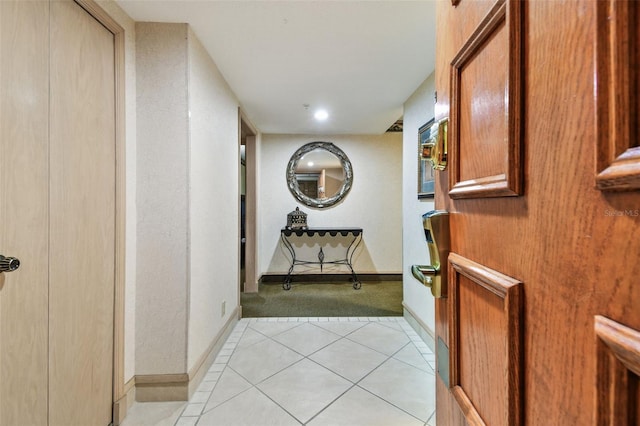 corridor with light tile patterned flooring