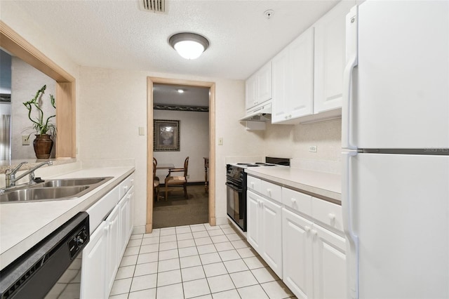 kitchen with sink, white refrigerator, dishwasher, white cabinetry, and range with electric stovetop