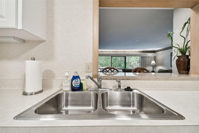 kitchen with white cabinetry and sink