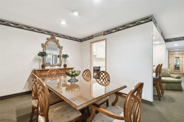 view of carpeted dining space