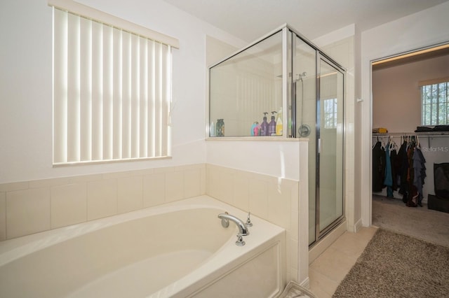 bathroom featuring plus walk in shower