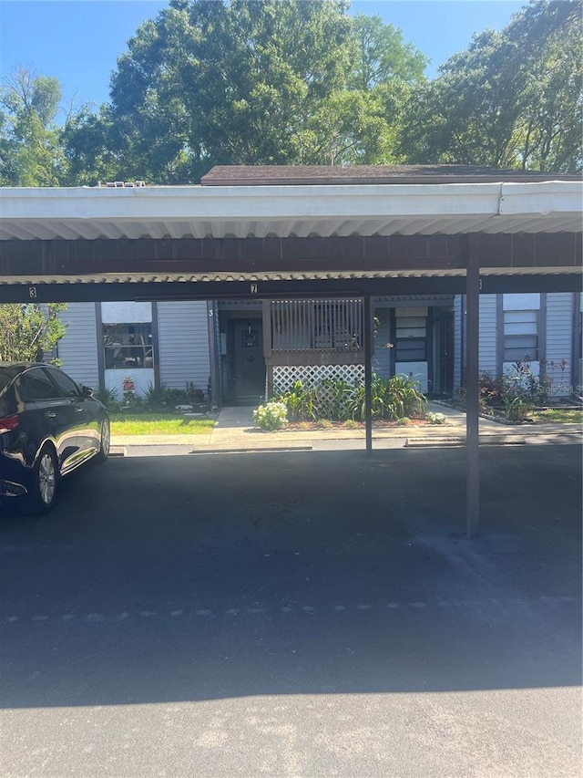 view of vehicle parking featuring a carport