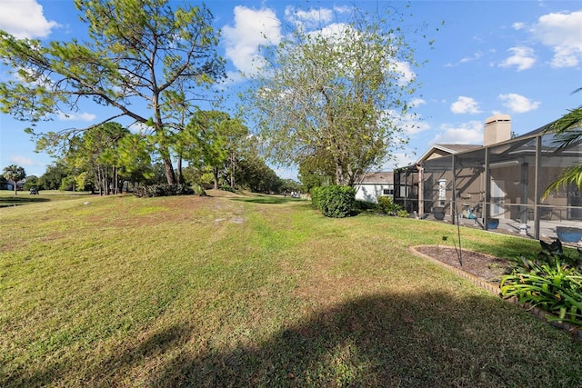 view of yard with a lanai