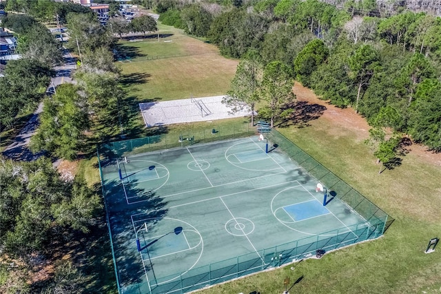 view of basketball court featuring a yard